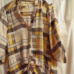 very beautiful blouse with a yellow plaid design button up mid sleeve